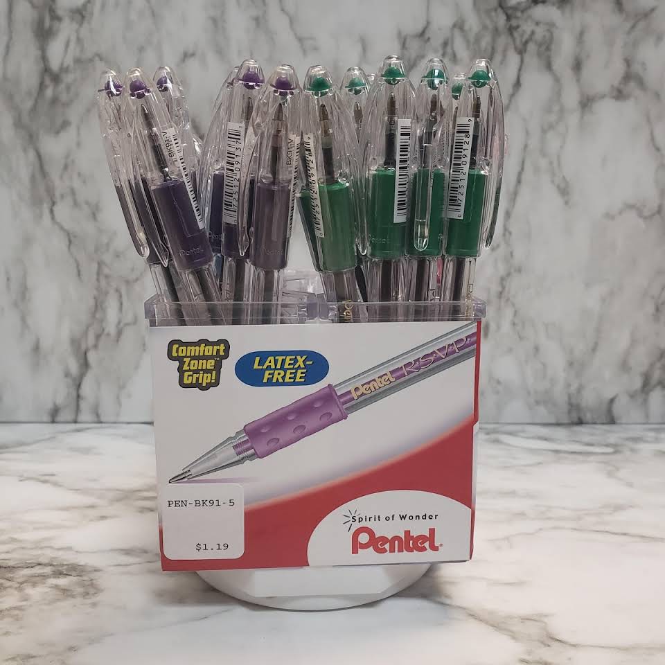 A cup full of pens sitting on top of a counter