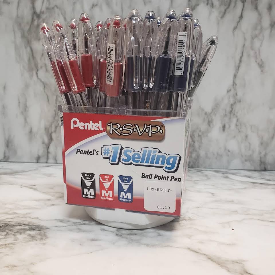A bunch of pens sitting in a container on a table